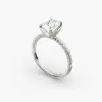 Platinum oval petite pavé engagement rings under $2,500 featuring a 1.5 carat oval lab-grown diamond and 20 French cut natural diamonds.