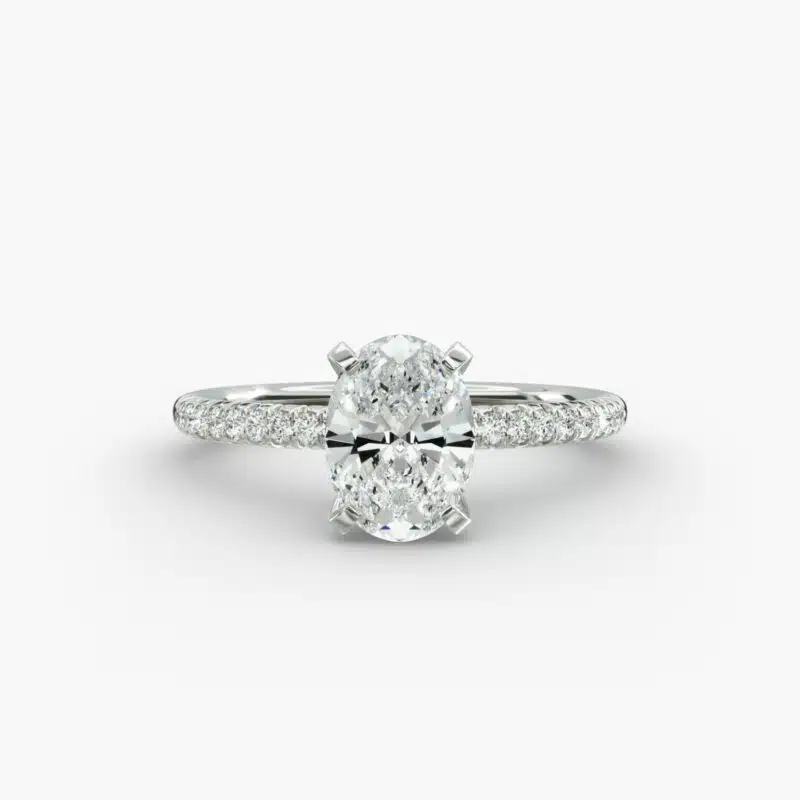 Platinum oval petite pavé engagement rings under $2,500 featuring a 1.5 carat oval lab-grown diamond and 20 French cut natural diamonds.