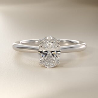 Platinum oval solitaire engagement rings under $2,500 featuring a 1.5 carat oval lab-grown diamond on a 1.80mm petite band.