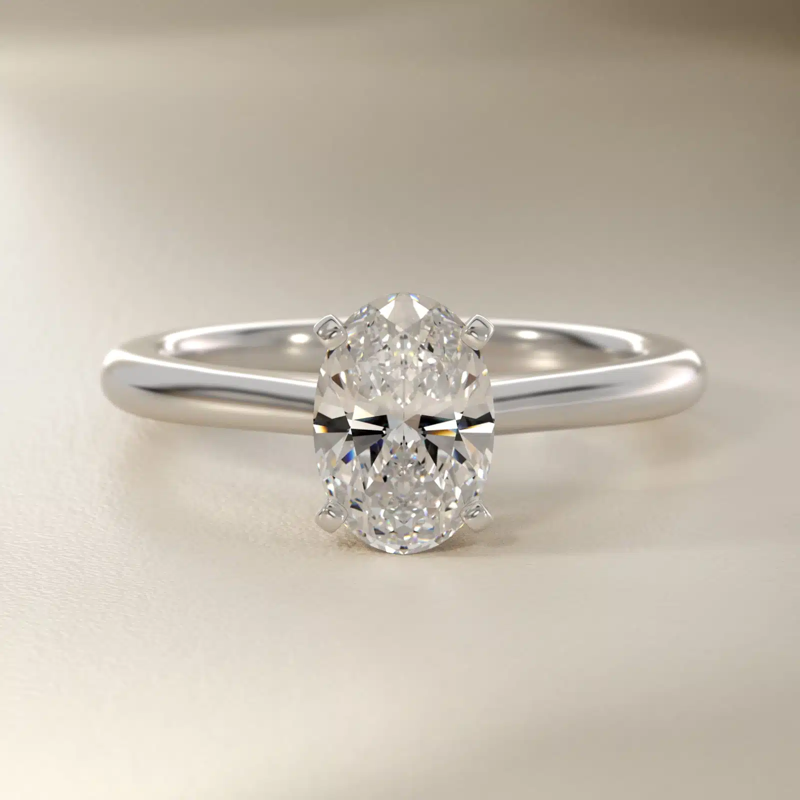 Platinum oval solitaire engagement rings under $2,500 featuring a 1.5 carat oval lab-grown diamond on a 1.80mm petite band.