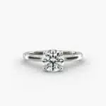 Platinum round solitaire engagement rings under $2,500 featuring a 1 carat round lab grown diamond with claw prongs on a 2.00mm flush-fit band.
