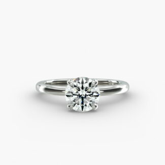 Platinum round solitaire engagement rings under $2,500 featuring a 1 carat round lab grown diamond with claw prongs on a 2.00mm flush-fit band.