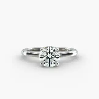 Platinum round solitaire engagement rings under $2,500 featuring a 1 carat round lab grown diamond with claw prongs on a 2.00mm flush-fit band.