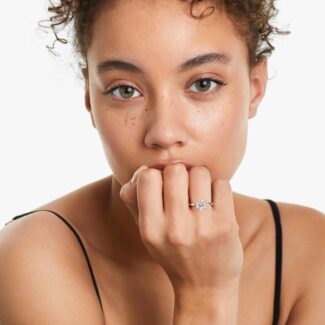 Platinum round solitaire engagement rings under $2,500 featuring a 1 carat round lab grown diamond with claw prongs on a 2.00mm flush-fit band.