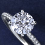 Platinum round micropavé engagement rings under $2,500 featuring a 1 carat round lab-grown diamond and 22 natural diamond accents on a 1.70mm band.