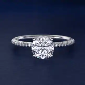 Platinum round micropavé engagement rings under $2,500 featuring a 1 carat round lab-grown diamond and 22 natural diamond accents on a 1.70mm band.