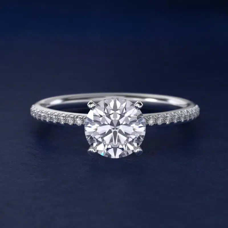Platinum round micropavé engagement rings under $2,500 featuring a 1 carat round lab-grown diamond and 22 natural diamond accents on a 1.70mm band.