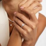 Platinum round micropavé engagement rings under $2,500 featuring a 1 carat round lab-grown diamond and 22 natural diamond accents on a 1.70mm band.