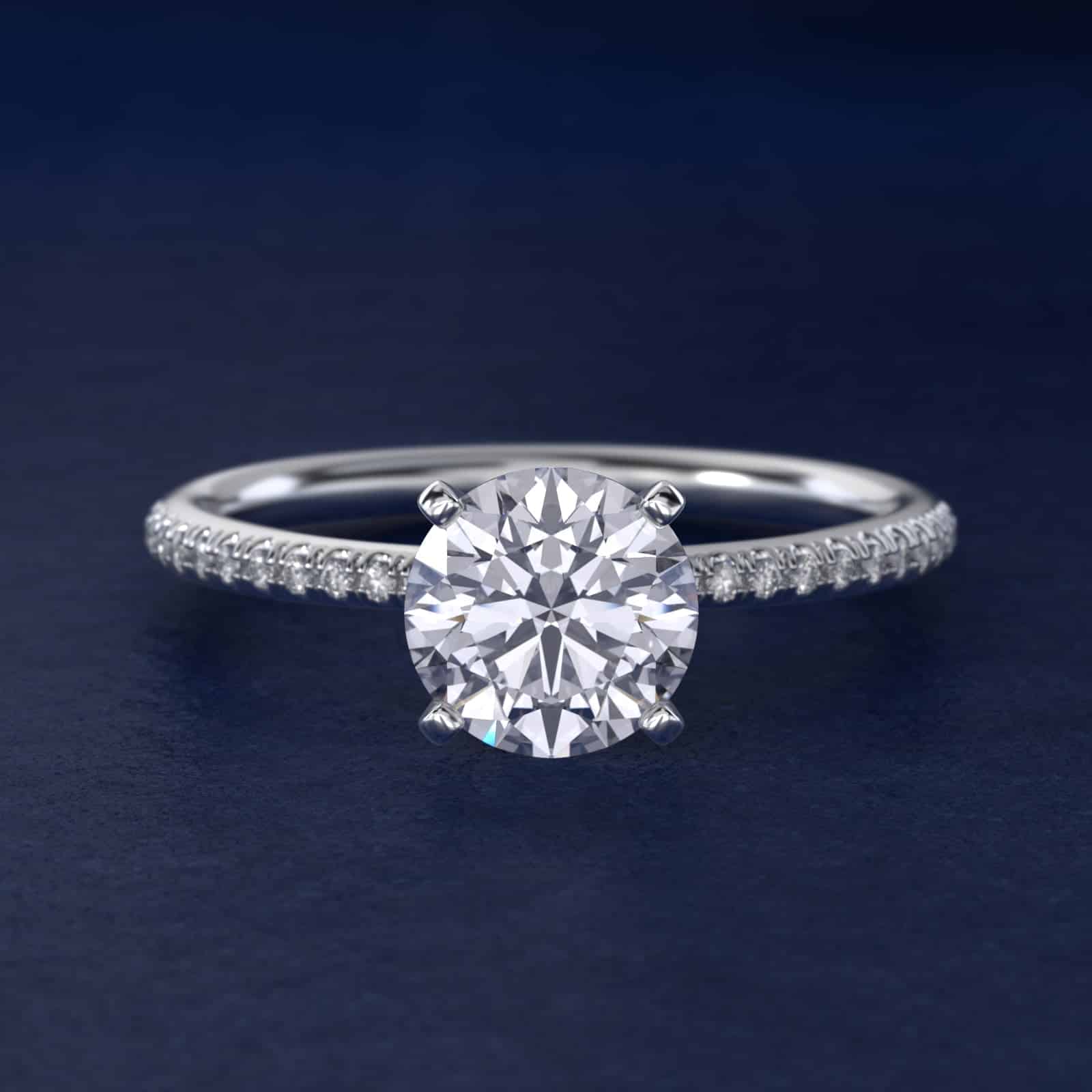 Platinum round micropavé engagement rings under $2,500 featuring a 1 carat round lab-grown diamond and 22 natural diamond accents on a 1.70mm band.