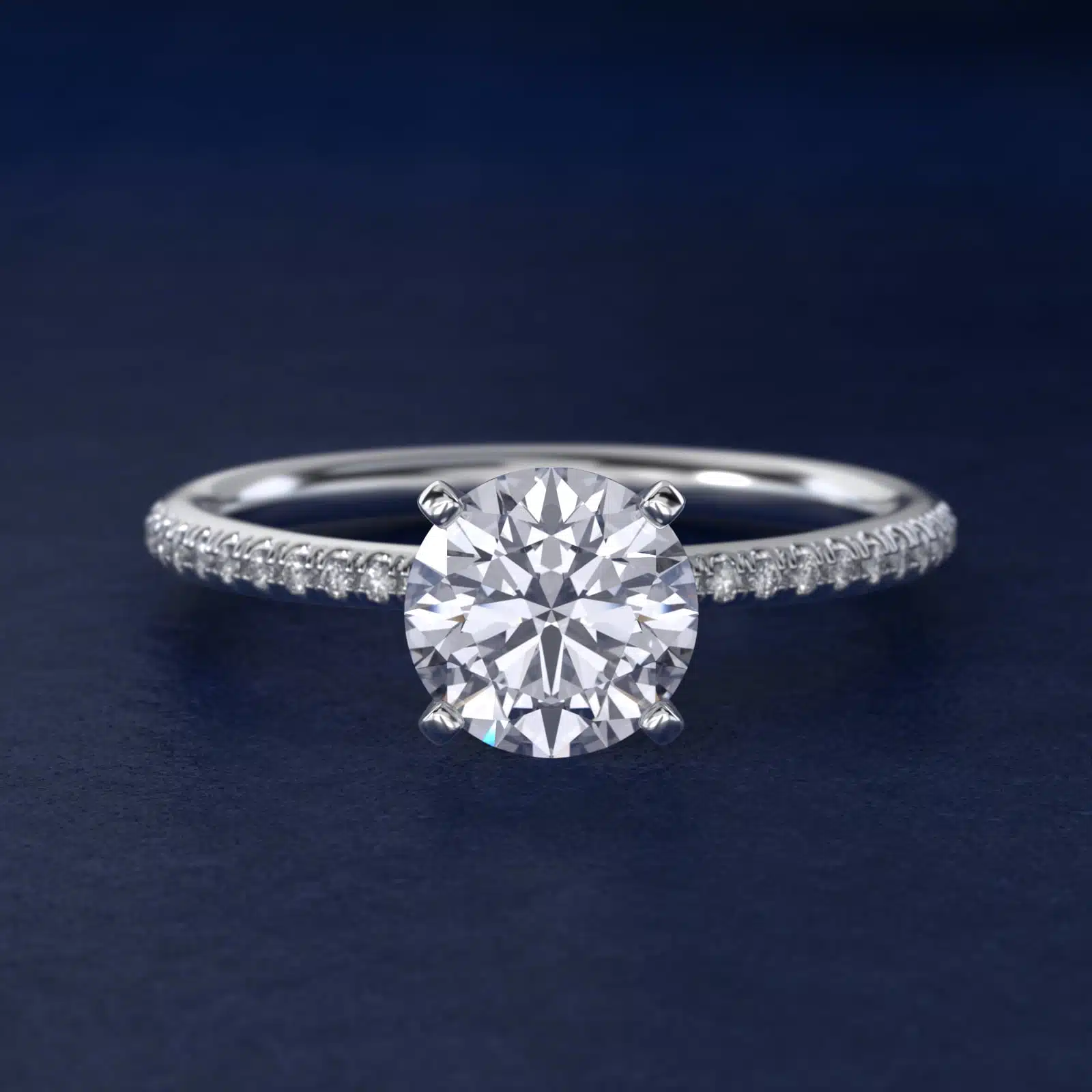 Platinum round micropavé engagement rings under $2,500 featuring a 1 carat round lab-grown diamond and 22 natural diamond accents on a 1.70mm band.