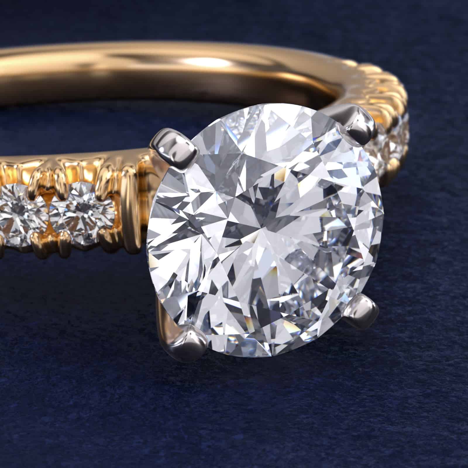 14K yellow gold French pavé engagement rings under $2,500 featuring a 1 carat round lab grown diamond and 16 natural diamond accents.