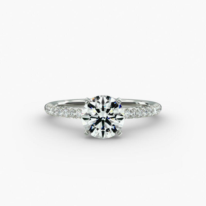 Platinum round petite pavé engagement rings under $2,500 featuring a 1.5 carat round lab-grown diamond and 20 French cut natural diamonds on a 1.60mm band.