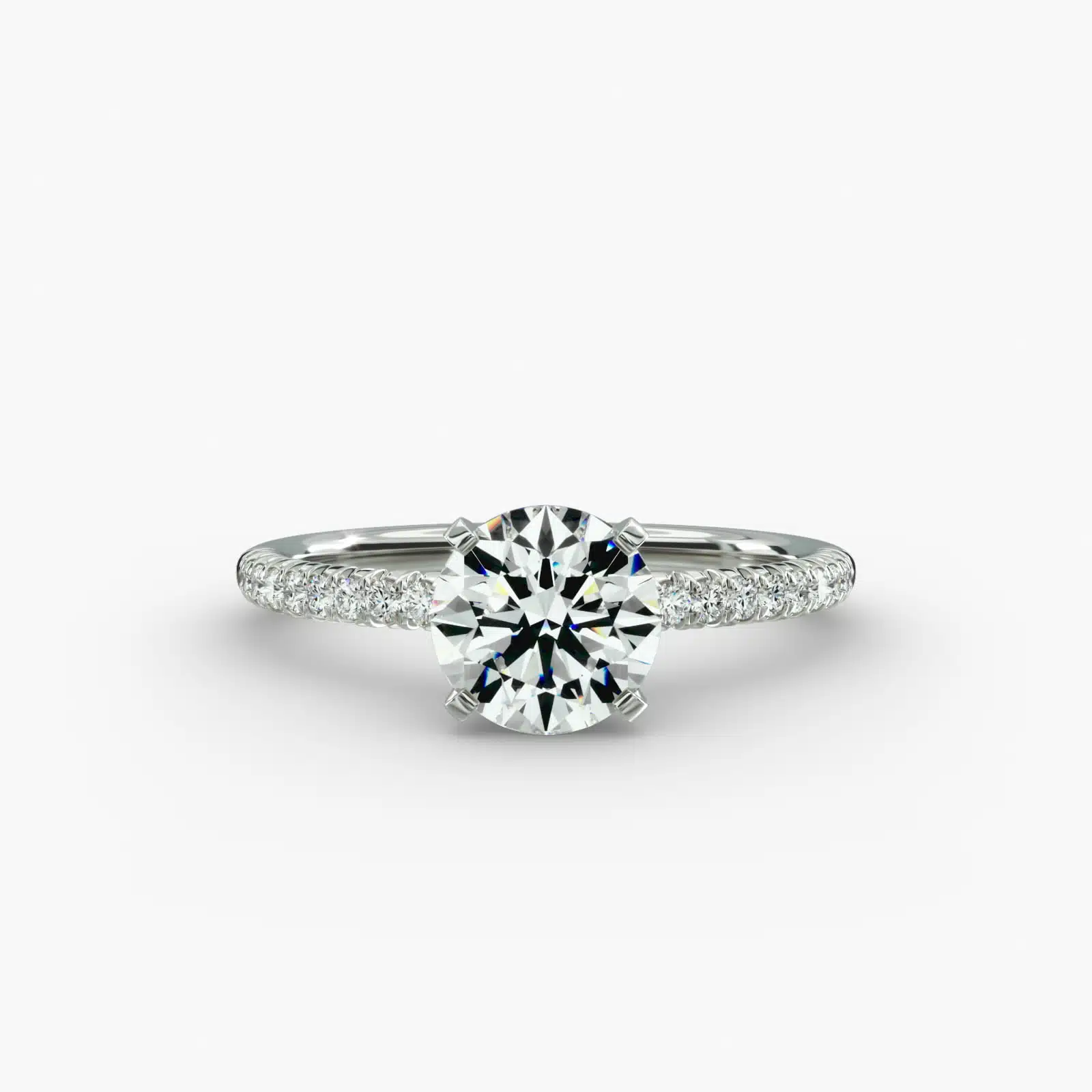 Platinum round petite pavé engagement rings under $2,500 featuring a 1.5 carat round lab-grown diamond and 20 French cut natural diamonds on a 1.60mm band.