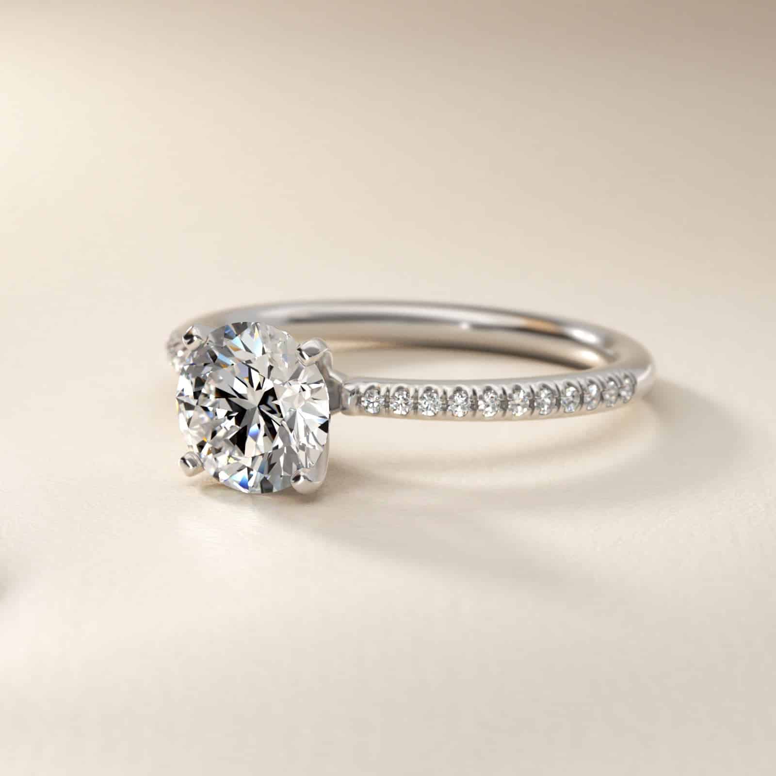 14K white gold micropavé engagement rings under $2,500 featuring a 1.5 carat round lab grown diamond and 22 natural diamond accents on a 1.70mm band.