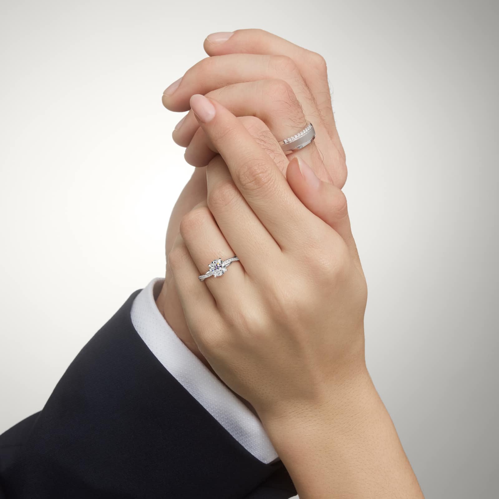 14K white gold petite twist engagement rings under $2,500 featuring a 1.5 carat round lab grown diamond and 20 pavé natural diamonds on a 2.80mm shank.