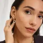 14K white gold petite twist engagement rings under $2,500 featuring a 1.5 carat round lab grown diamond and 20 pavé natural diamonds on a 2.80mm shank.