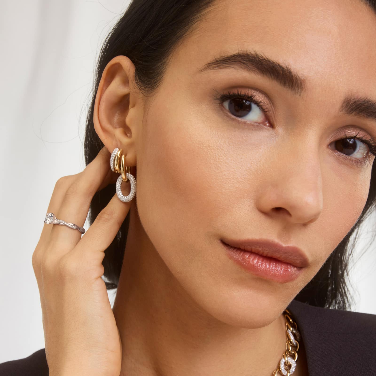 14K white gold petite twist engagement rings under $2,500 featuring a 1.5 carat round lab grown diamond and 20 pavé natural diamonds on a 2.80mm shank.