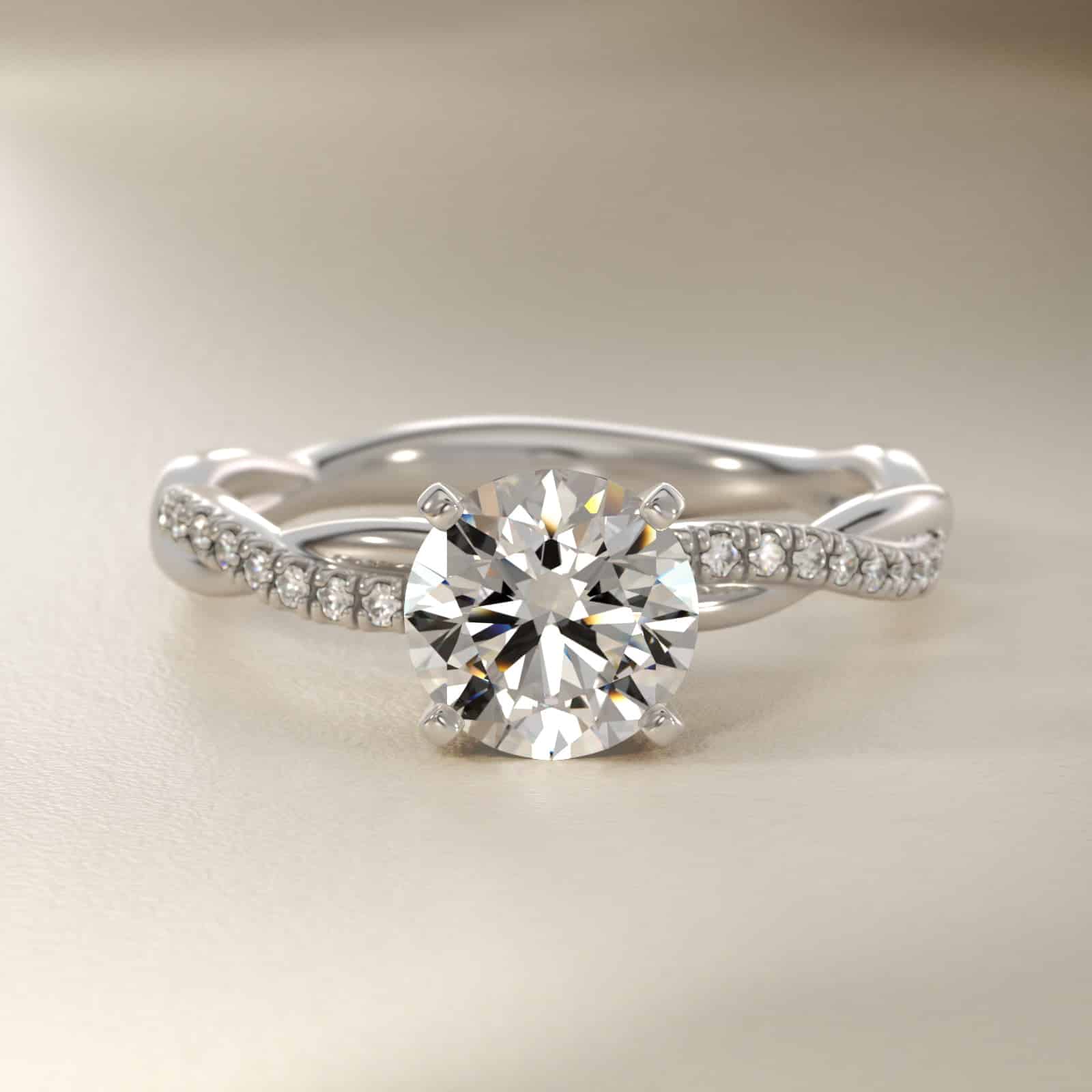 14K white gold petite twist engagement rings under $2,500 featuring a 1.5 carat round lab grown diamond and 20 pavé natural diamonds on a 2.80mm shank.