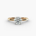 14K yellow gold round solitaire engagement rings under $2,500 featuring a 2 carat colorless VS clarity lab grown diamond with claw prongs.