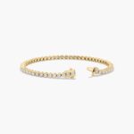 14K yellow gold round lab grown diamond tennis bracelets under $3000 featuring 3 CTW of brilliant-cut diamonds in basket settings.