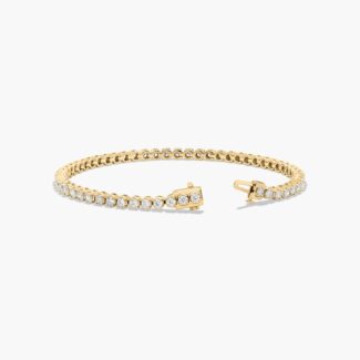 14K yellow gold round lab grown diamond tennis bracelets under $3000 featuring 3 CTW of brilliant-cut diamonds in basket settings.