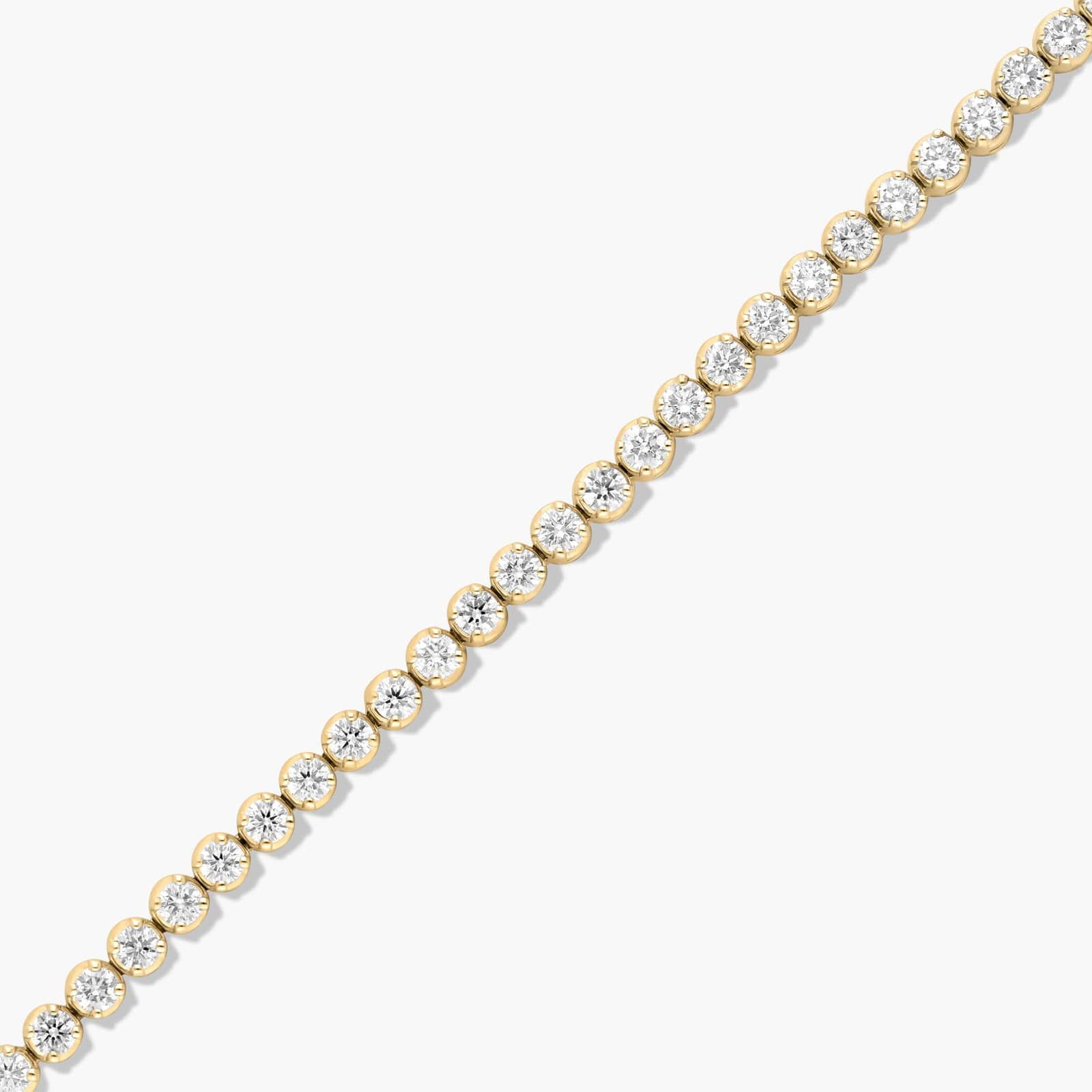 14K yellow gold round lab grown diamond tennis bracelets under $3000 featuring 3 CTW of brilliant-cut diamonds in basket settings.