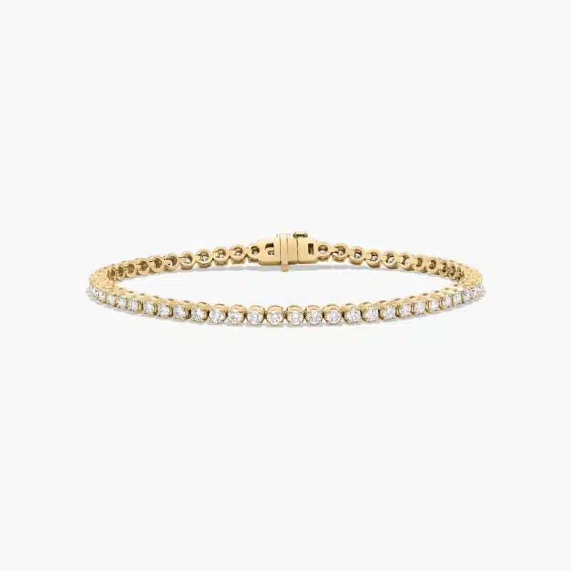 14K yellow gold round lab grown diamond tennis bracelets under $3000 featuring 3 CTW of brilliant-cut diamonds in basket settings.