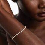 14K yellow gold round lab grown diamond tennis bracelets under $3000 featuring 3 CTW of brilliant-cut diamonds in basket settings.