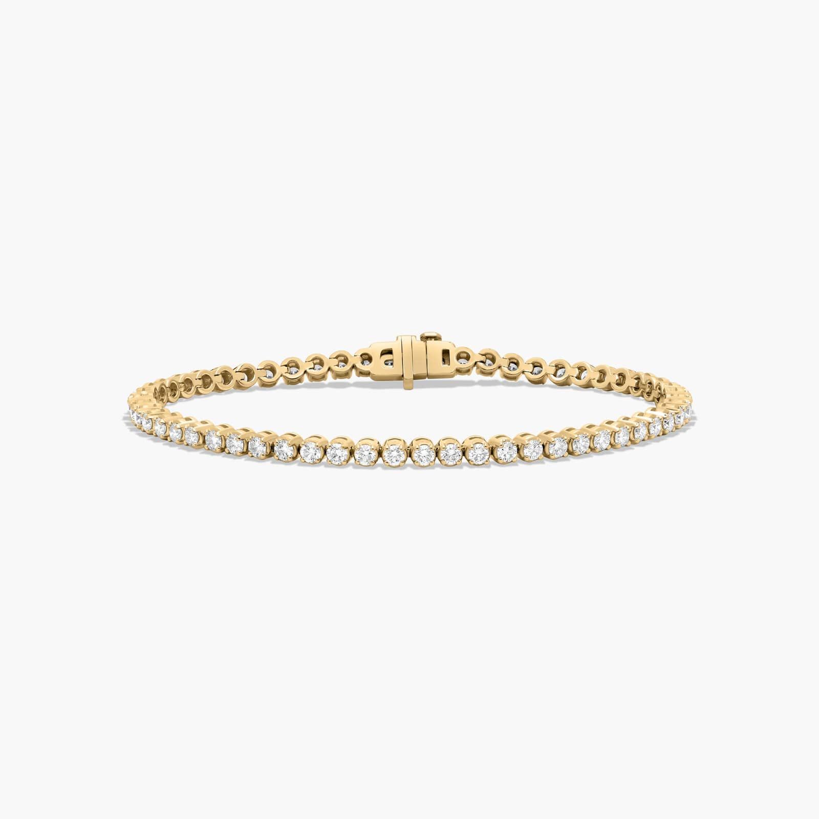 14K yellow gold round lab grown diamond tennis bracelets under $3000 featuring 3 CTW of brilliant-cut diamonds in basket settings.