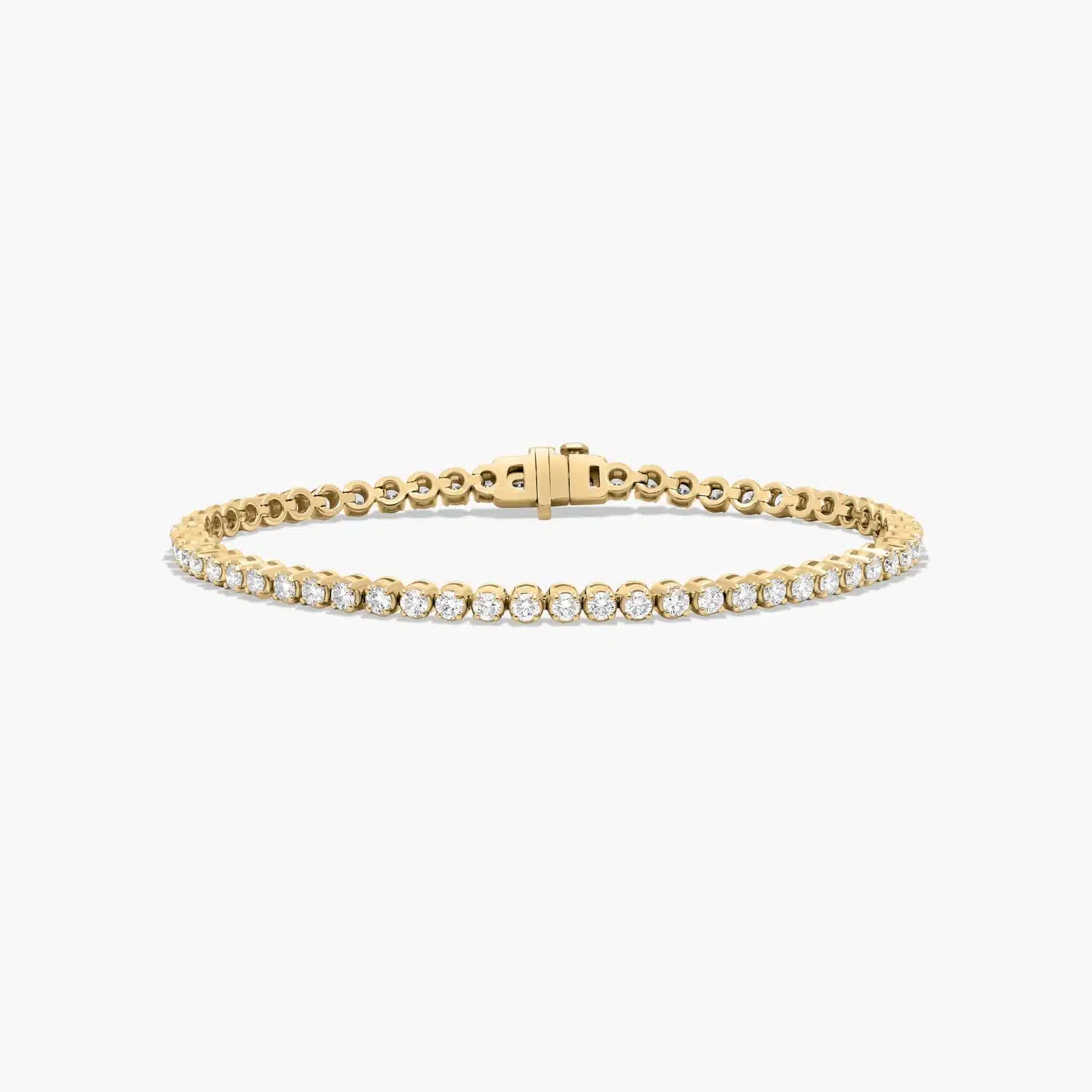 14K yellow gold round lab grown diamond tennis bracelets under $3000 featuring 3 CTW of brilliant-cut diamonds in basket settings.