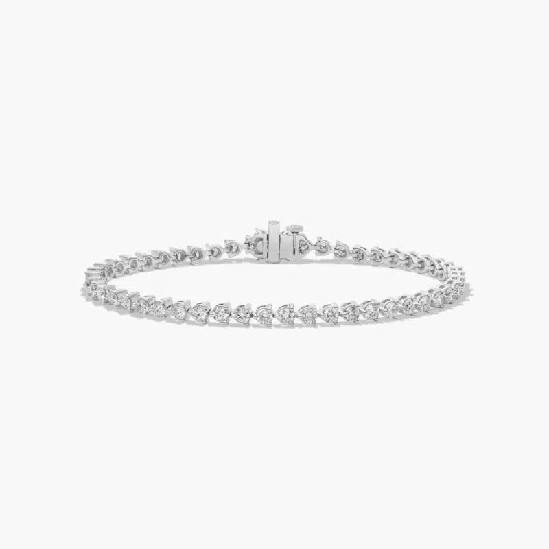 14K white gold round lab grown diamond tennis bracelets under $3000 featuring 4 CTW of brilliant diamonds and a floral box clasp.
