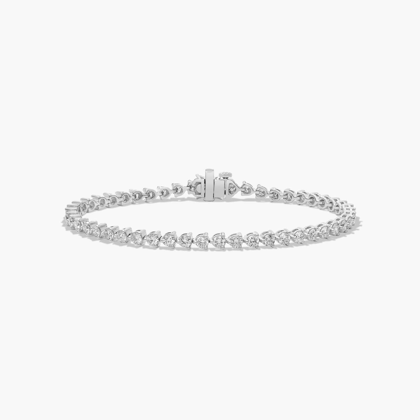 14K white gold round lab grown diamond tennis bracelets under $3000 featuring 4 CTW of brilliant diamonds and a floral box clasp.