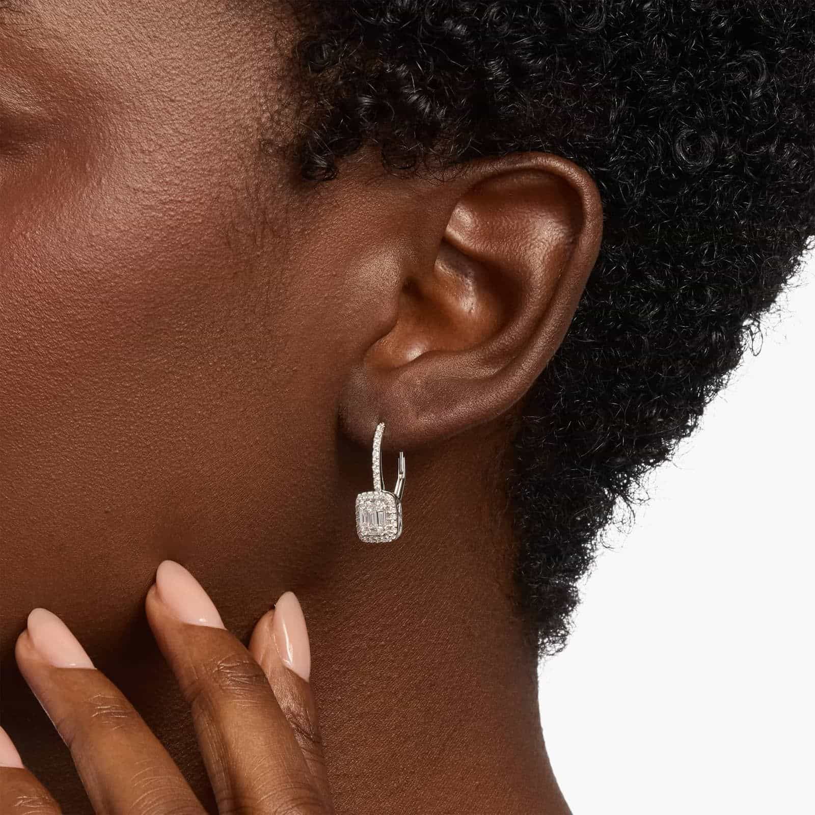 Shop luxury 18k white gold drop earrings. Featuring 82 natural baguette and round diamonds (3/4 ct. tw.) with secure lever backs for $2,422.